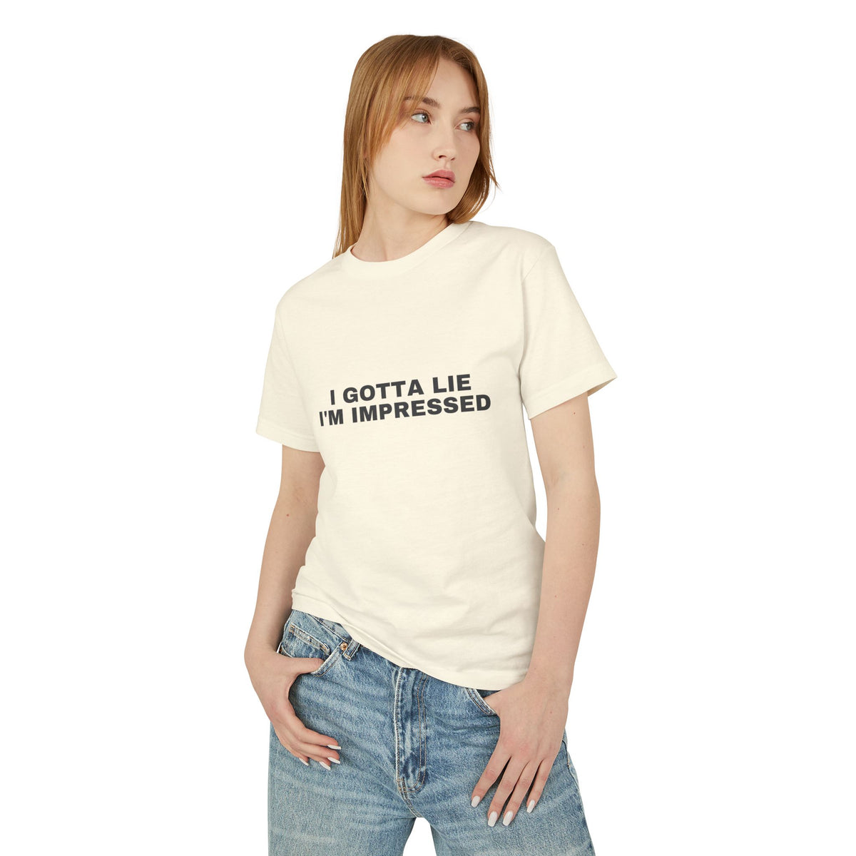 I Gotta Lie, I'm Impressed on a faded cream heavyweight tee