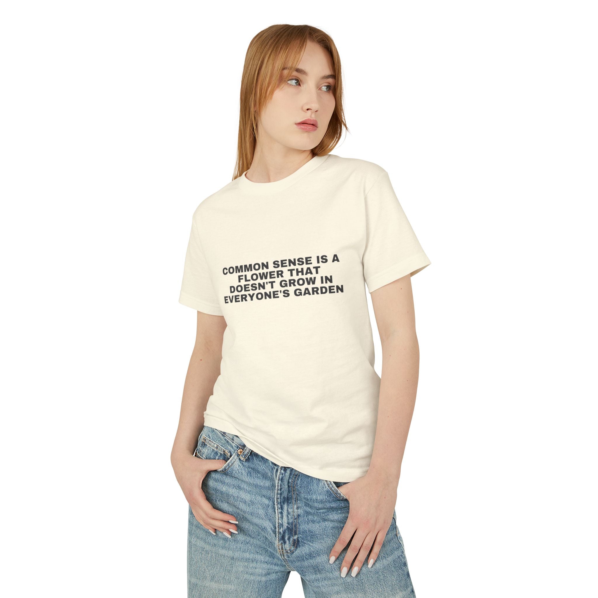 Common Sense Is A Flower That Doesn't Grow In Everyone's Garden on a faded cream heavyweight tee